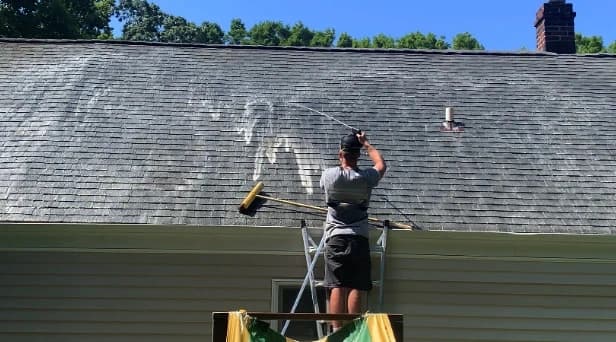 Before and after results of roof washing by Cleveland Power Washing in Cleveland