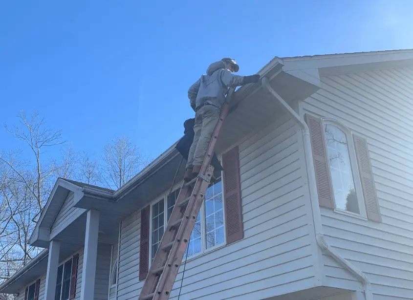 Gutter cleaning and maintenance being performed by Cleveland Power Washing in Cleveland