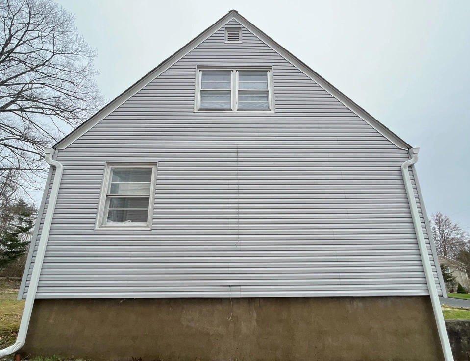 Cleveland Power Washing technician performing detailed house washing in Cleveland residential area
